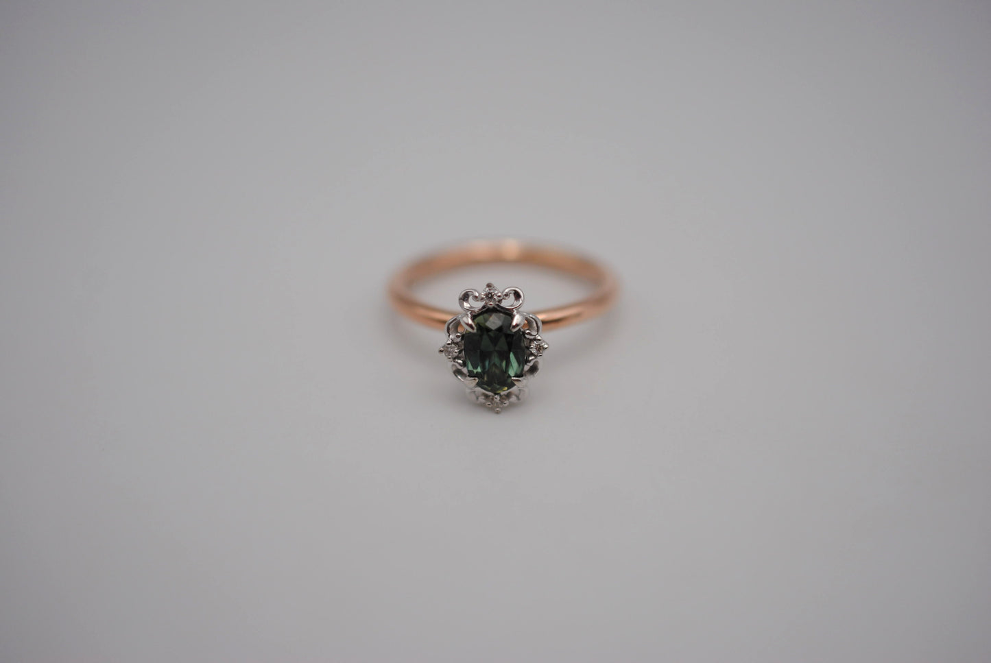 Sapphire Ring: Oval Cut, Rose Gold Band, Melee White Gold Setting